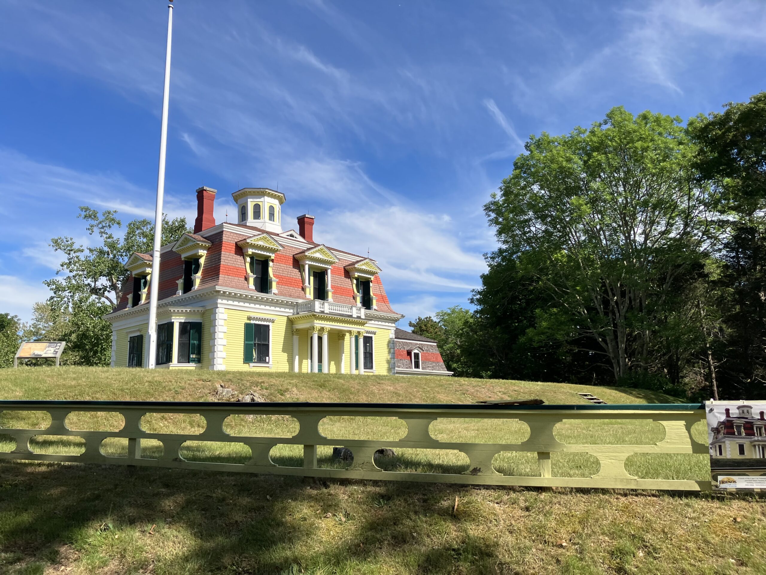 2.5 story, wood-frame structure with a mansard roof. The mansard roof is the characteristic feature of French Second Empire style architecture in mid-19th century America.